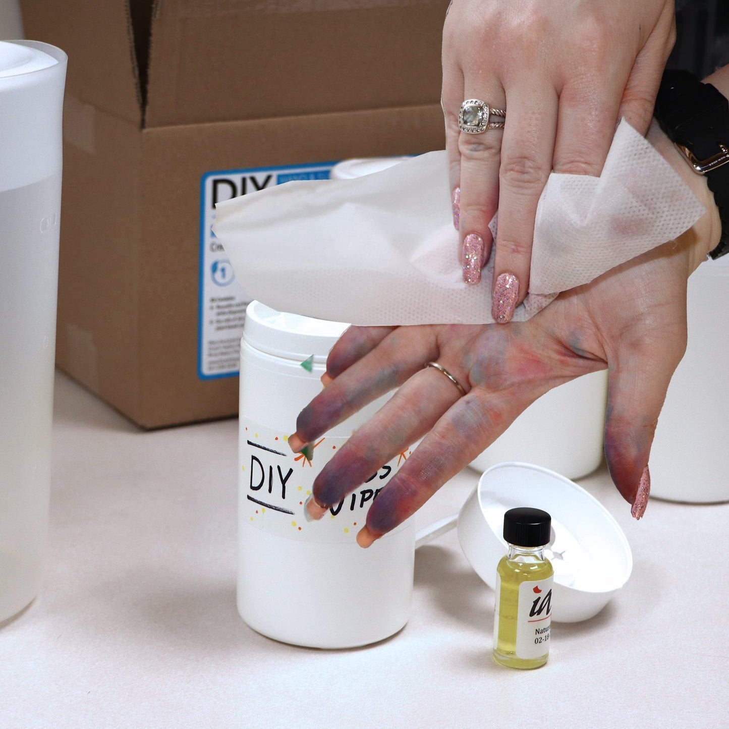 Wiping hands with wipes